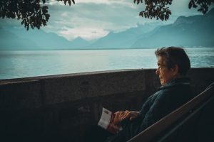 old man looking at lake. 